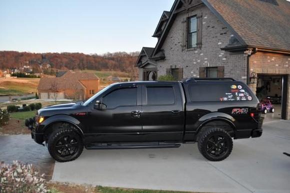 Factory wheels w/ new tires.
Stickers have been taken off since this pic was taken... couldn't take it not being all black.
