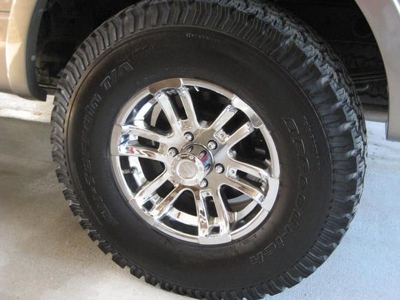315x70x17 BFG All Terrains on 17x8 American Racing "Crush" wheels.
