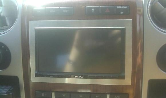 custom in dash deck with a custom brushed surrounding