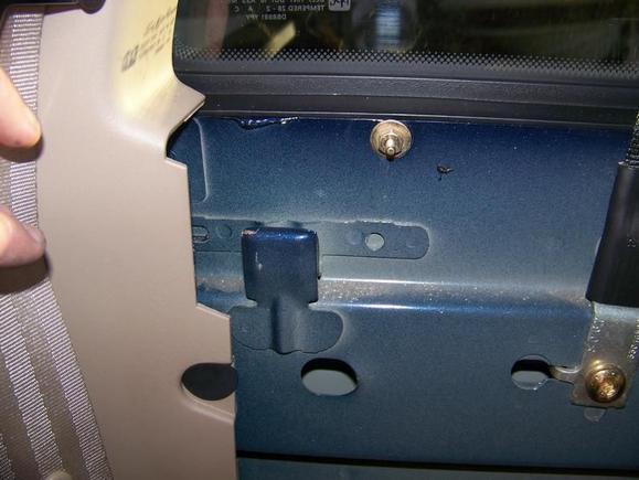 where the seat has to "hook" on up top
