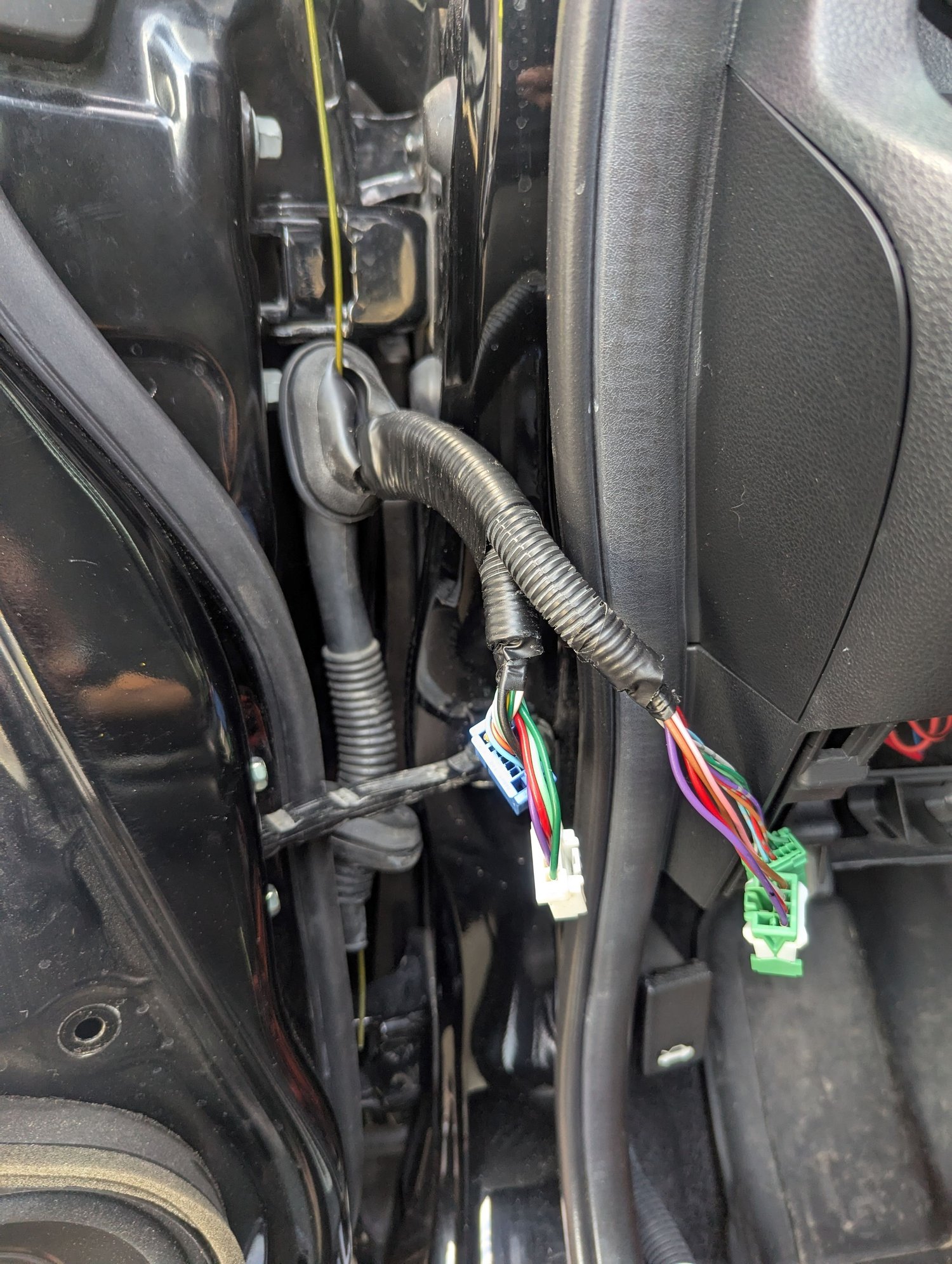 Found it easier to unplug the harness in order to fish the coat hanger through.