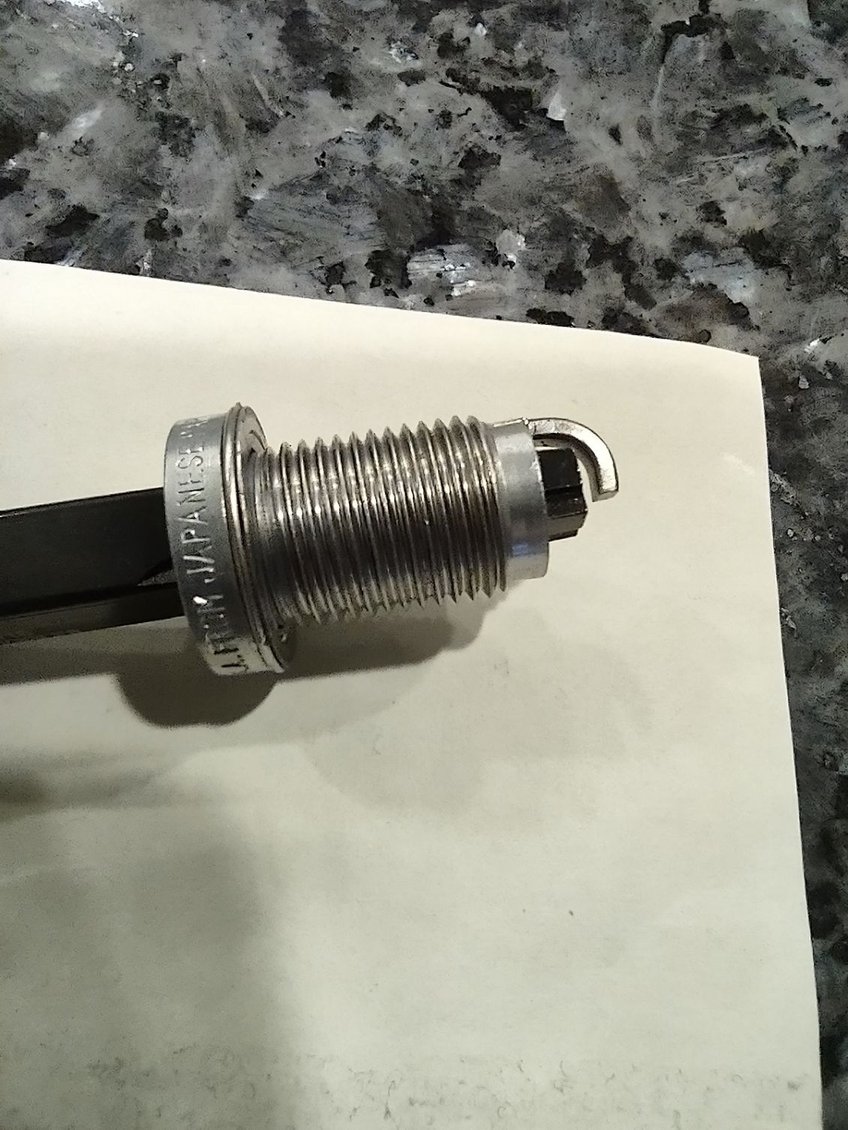 view of the extractor seated in the broken plug after removal.