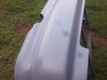 Rear bumper with molded bottom piece.
