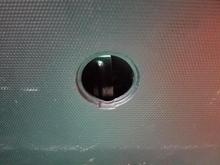 Access hole at the bottom of the hatch door, 2008 Honda Fit