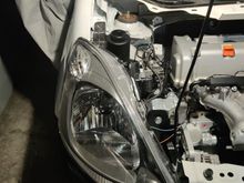 Washer fluid bottle removed and replaced.