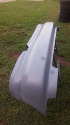 Rear bumper with molded bottom piece.