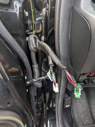 Found it easier to unplug the harness in order to fish the coat hanger through.