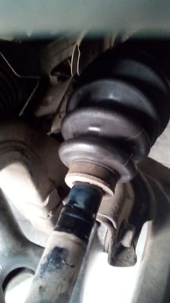 Notice greased area of axle that has been displaced from the inside of the boot