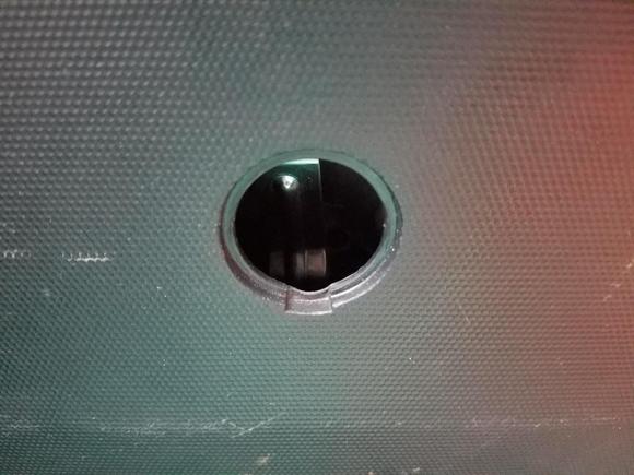 Access hole at the bottom of the hatch door, 2008 Honda Fit