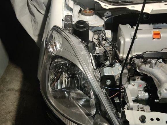 Washer fluid bottle removed and replaced.