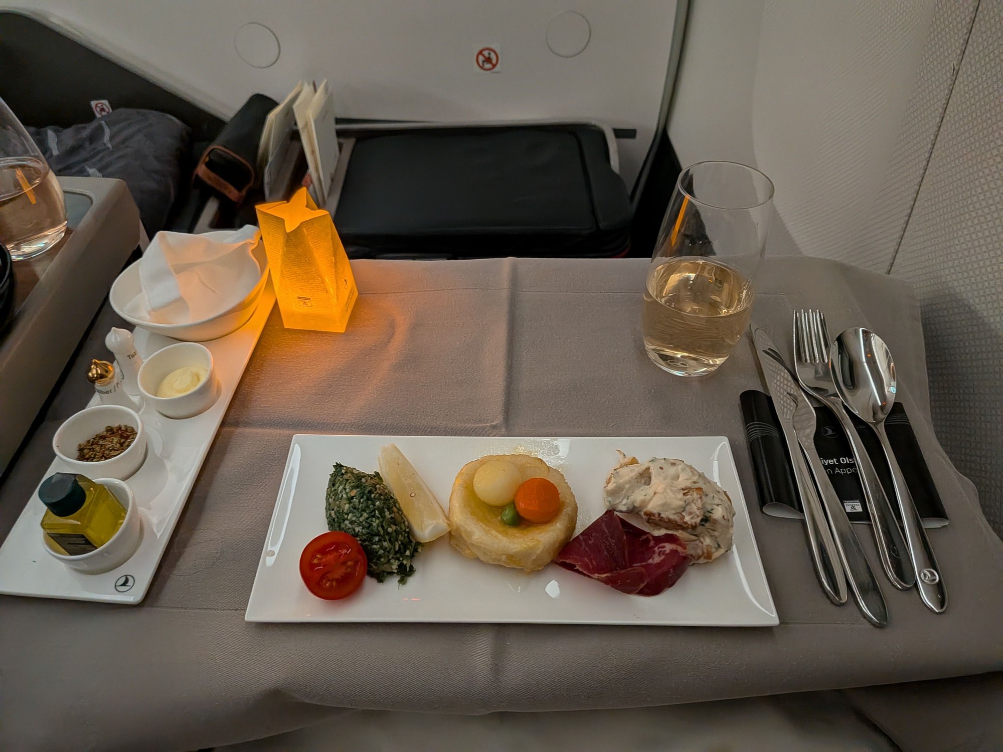 Mezze was very good. Tasted fresher than the same items I had sampled in the lounge, in particular the tabbouli was probably the freshest Ive had anywhere. The beef prosciutto thing was a bit tough for a cured meat to me. Also does anyone know what the name of the dish in the center is? I havent been able to identify what it is made of.