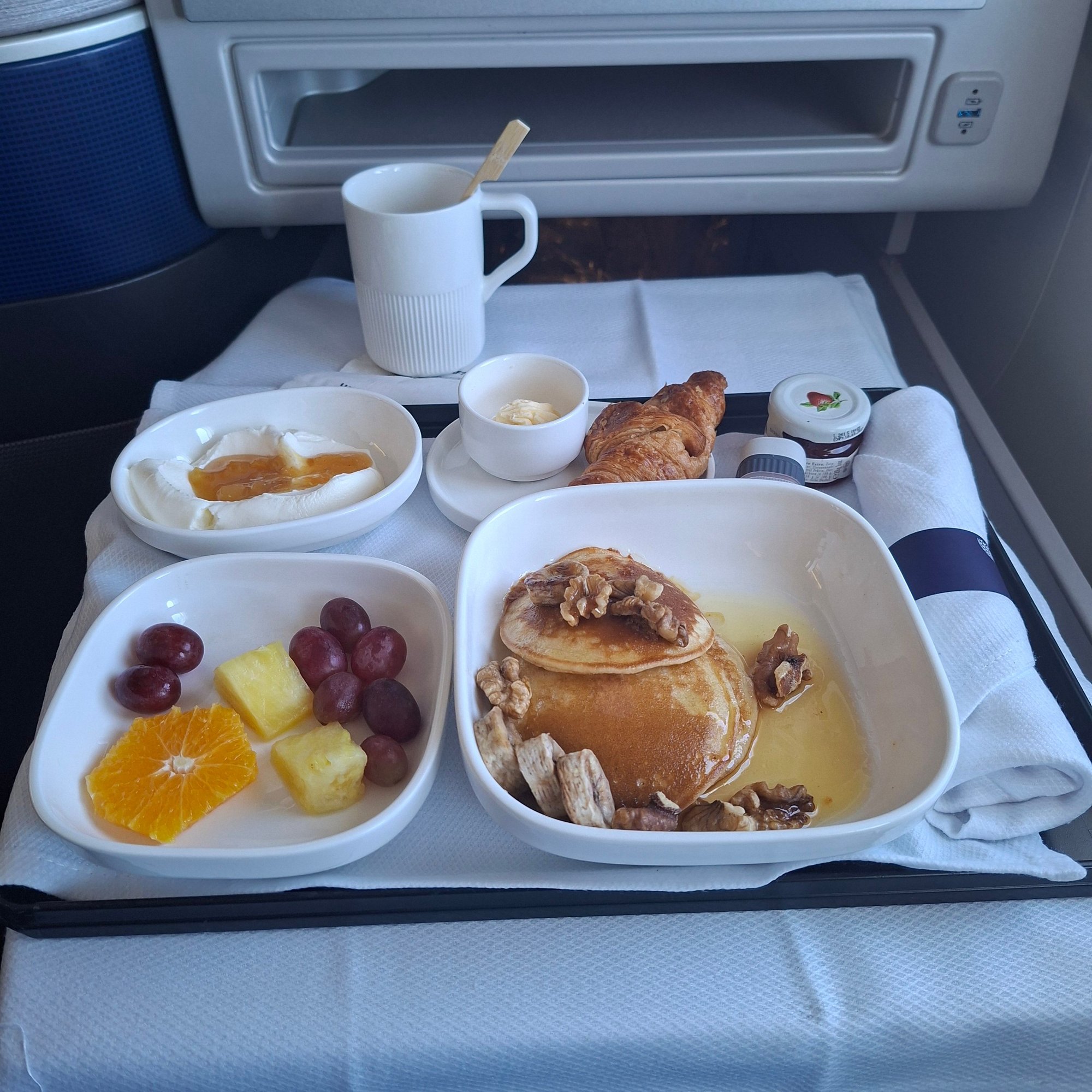 Sad sad breakfast. The crossaint was tiny and super hard. The Greek yogurt decent. The pancakes were the kind you make with a premix at home with 3 banana chucks tossed on top with a handful of walnuts.