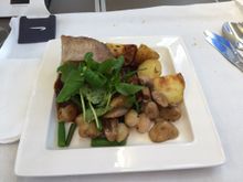 Braised beef with herb roasted new potatoes, sautéed mushrooms, baby onions, fine green beans and red wine sauce.  Was ok, more sauce would have helped as the beef was pretty dry.