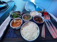 3 tiny blocks of sweet chicken, a huge bowl of dry rice and a little cod in a sauce I still taste after 5 hours (spoiler: didn't like it first hand, nor now).