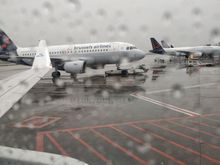Departure from BRU, under the rain...