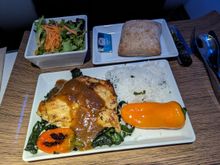 Jerk chicken over kale with rice