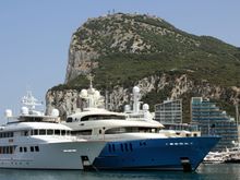 Big boats, and a bigger rock