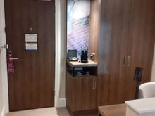 Entrance to 527 with cupboard ( safe inside) and Nespresso machine