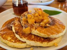 Pancakes were delicious.  Cinnamon infused, nice chars on the bottom of each pancake.  Mac sauce drizzled on the top with fresh pineapples.  Coconut and regular syrup.  Delish!