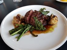 Flat Iron Steak - porcini crust (couldn't taste it), cippolini onion demi (great), cauliflower grilled and pureed.   Perfect medium rare.