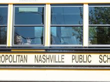 A child weeps while on the bus leaving The Covenant School following a mass shooting at the school in Nashville, Tenn., Monday, March 27, 2023. (Nicole Hester/The Tennessean via AP)