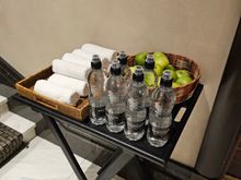 Towels, water and apples at the front door in the morning