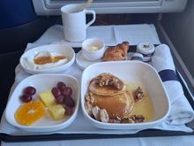 Sad sad breakfast. The crossaint was tiny and super hard. The Greek yogurt decent. The pancakes were the kind you make with a premix at home with 3 banana chucks tossed on top with a handful of walnuts.