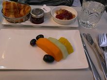 No main breakfast, just fruit, a croissant followed by a second croissant and two mugs of coffee. 
Very attentive lady as cabin crew. My nice neighbour who during conversation mentioned he travelled BA lots and was a GGL had a defective seat in J which was manually declined for him after dinner. The lady took his details so obviously lots of Avios coming his way. 

