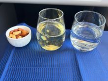 Warmed nuts. Wine and water. 