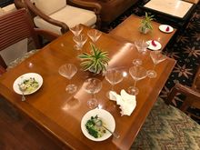 Half eaten stuff and a spilled martini wasteland