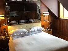 Wainscot room with one small window.