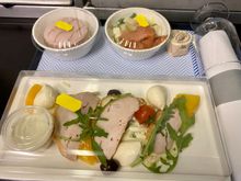 Smoked chicken with celeriac remoulade, mozzarella, poached peach, olives, rocket, cherry tomato, and blue cheese dressing