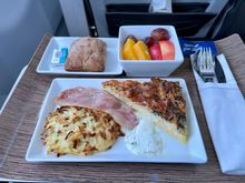 Everything Bagel Quiche with crisp Irish bacon, sweet apple potato pancake and a lime and cilantro crema. Served with fresh fruit and warm raisin roll.