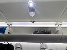 “Larger” side overhead.  I think it would be tough to fit anything with wheels. 