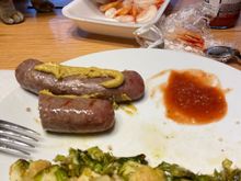 Beer brats with deli mustard, roasted Brussels sprouts with garlic, cocktail shrimp with Trader Joe’s cocktail sauce. One of the cats inspected the shrimp for quality assurance.