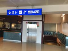 Lift / stairs / escalator access from main A concourse, opposite gate A16. Escalator is down only. 