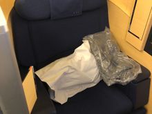 Seat with pillow and pajamas. 