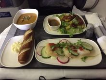 Appetizer spread - Chilled shrimp with spicy tomato vinaigrette, baby romaine salad with roasted delicata squash, and sweet potato soup