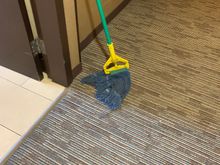 A mop in the hallway left there for over a day. 