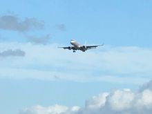 A flight is landing so the airport may be open. 