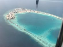 Man made island and some water villas and their foundations perhaps?