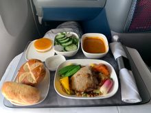 Delta One Main meal all on one tray now with salad, soup, breads and dessert. Three main course choices