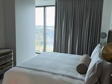 You have to walk by the bed to get to the living area