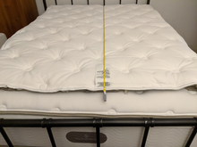 Replacement placed on top of existing topper, lined up at headboard.