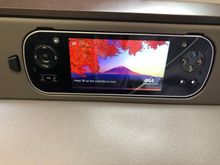 The remote was located within easy reach of my right hand, and I didn't have to take it out of the console in order to operate it. I ended up using the call button a couple times and a flight attendant always responded within 5-10 seconds.