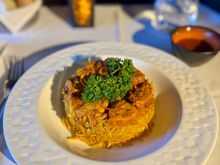 Gulf style chicken machboos with daqoos sauce crispy shallots, raisins and almonds. 10/10 !