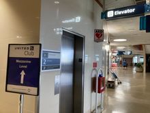In Terminal 2 at the G - concourse you can find this lift to the Mezzanine floor (stairs are visible in the background) 