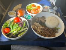 Had the bibimbop and enjoyed it.  Sauce servings in the plastic containers, everything at once (eating cold appetizer after my warm entree) are just stupid misses by United that cheapen what is supposed to be a premium service.

And I’m literally going to start clapping and cheering when United rehire the guy they let go at the start of the pandemic that knows how to spread the garlic butter completely across the slice of bread!