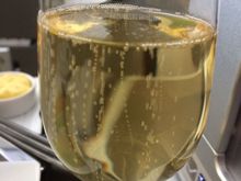 Replacement glass of chilled champagne with bubbles.