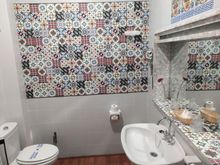 The bathroom was lovely, with tiles covering the walls 